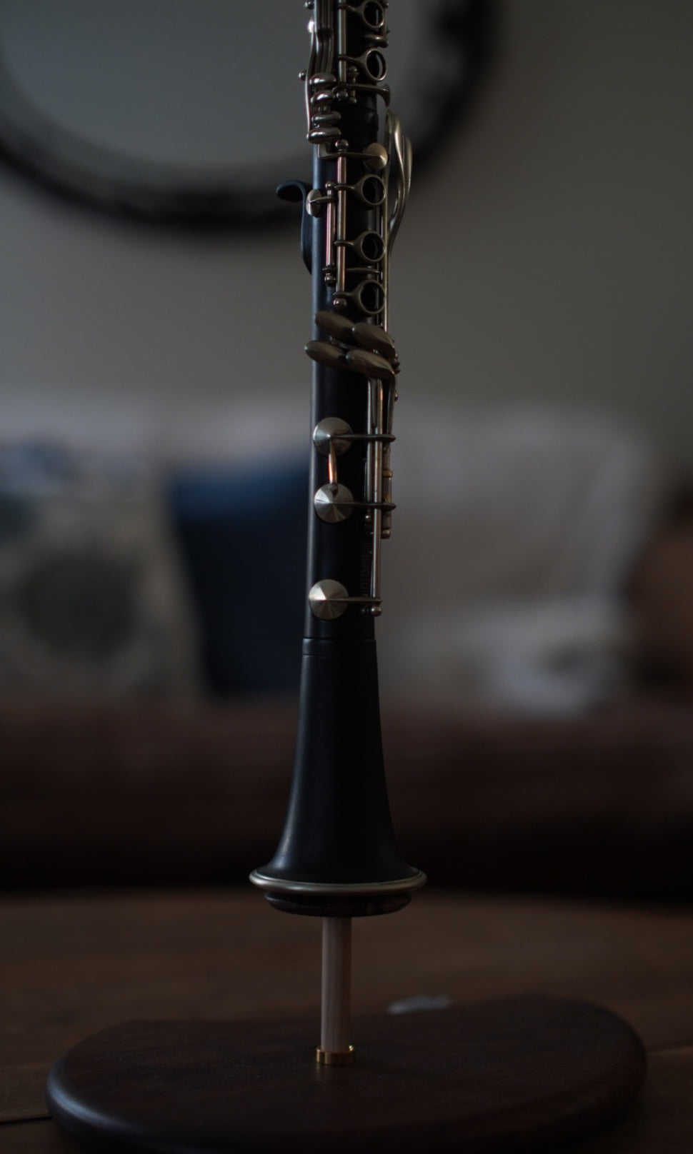 G Leblanc Vintage Clarinet on a stand with a blurred background