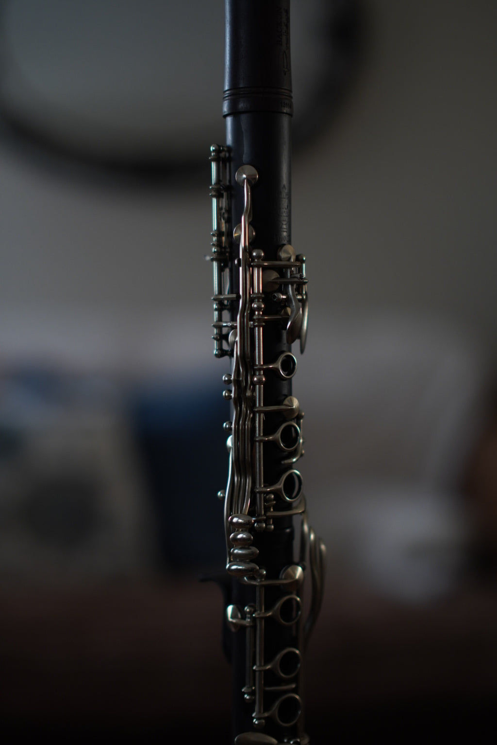 G Leblanc Vintage Clarinet on a stand with a blurred background