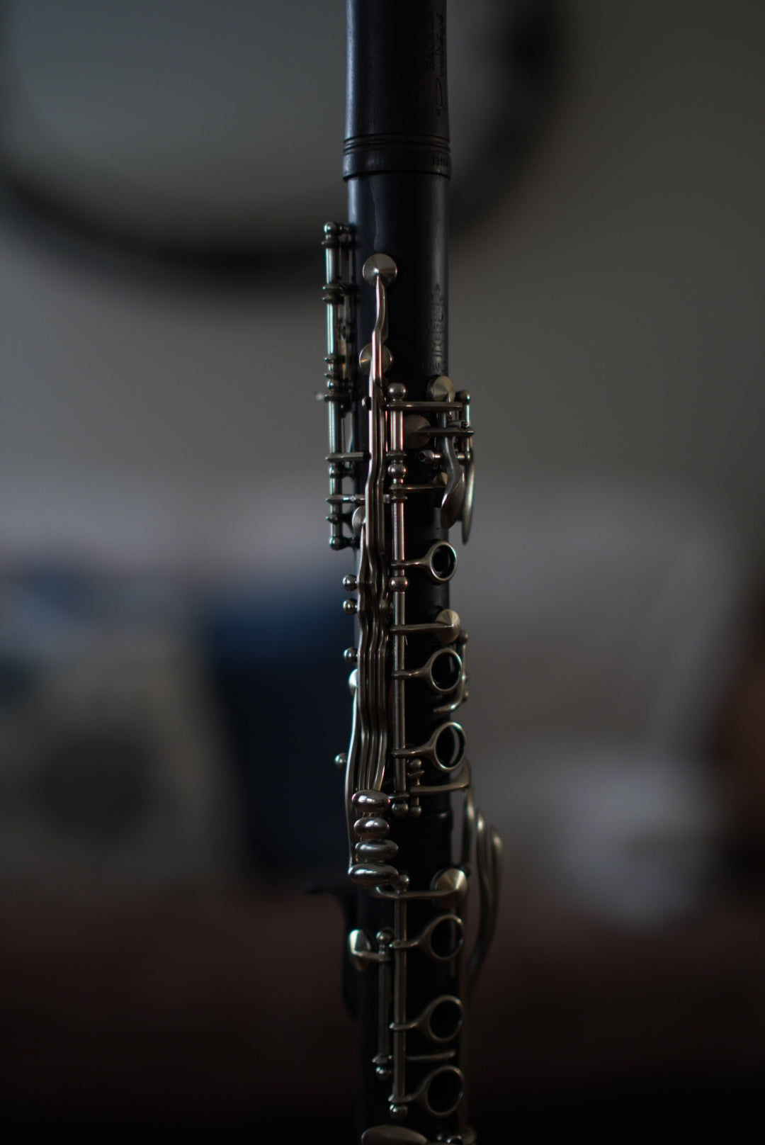 G Leblanc Vintage Clarinet on a stand with a blurred background