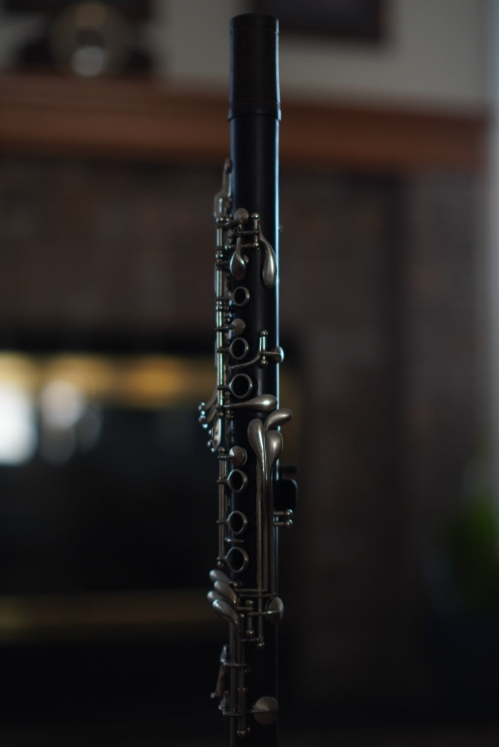 G Leblanc Vintage Clarinet on a stand with a blurred background