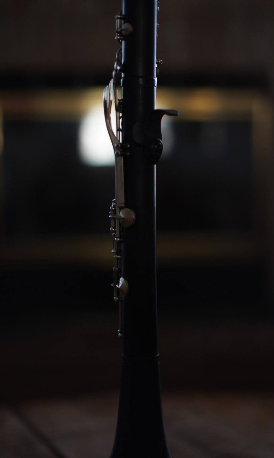 G Leblanc Vintage Clarinet on a stand with a blurred background