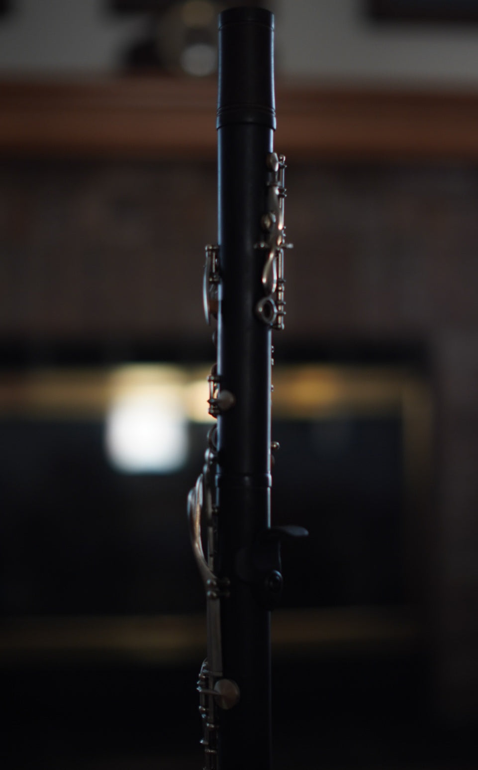 G Leblanc Vintage Clarinet on a stand with a blurred background