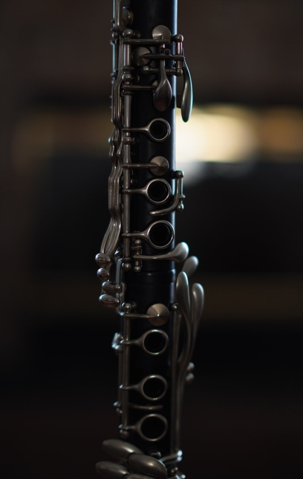 G Leblanc Vintage Clarinet on a stand with a blurred background