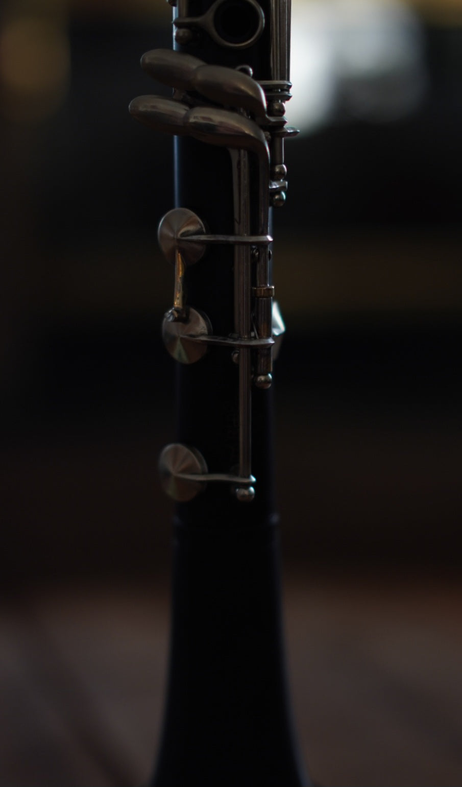 G Leblanc Vintage Clarinet on a stand with a blurred background