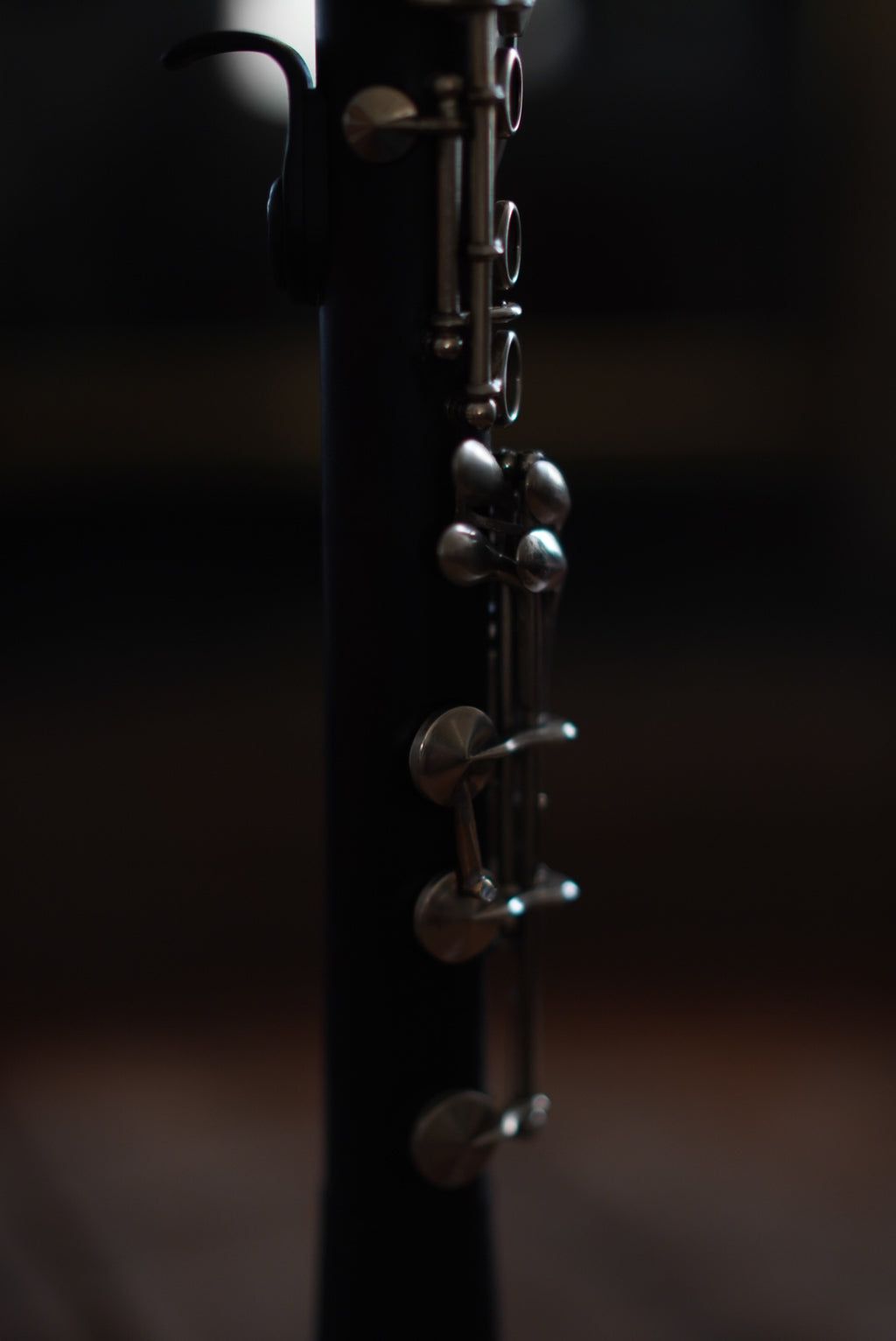 G Leblanc Vintage Clarinet on a stand with a blurred background