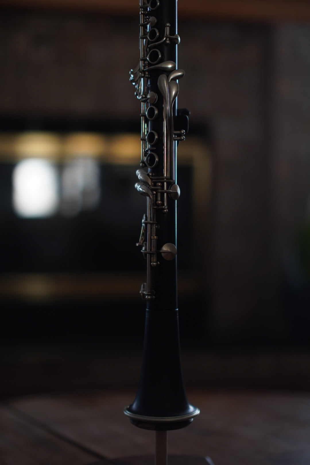 G Leblanc Vintage Clarinet on a stand with a blurred background