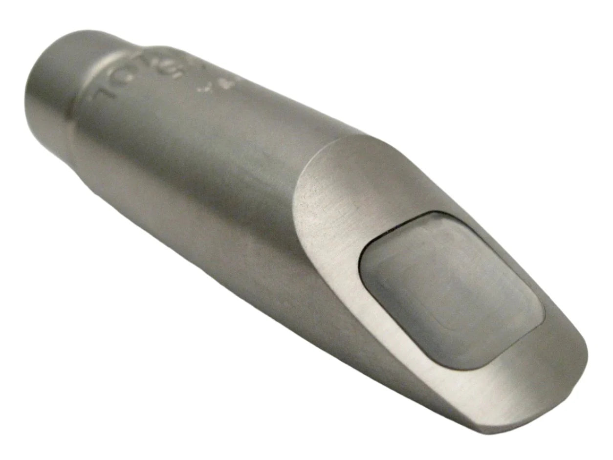 Metallic saxophone mouthpiece on a white background